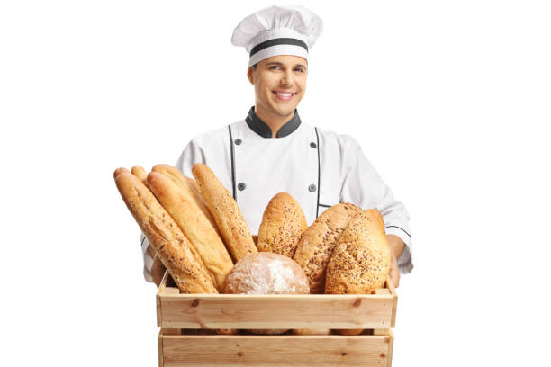 istock Young male baker holding a box with different types of bread 1095367622