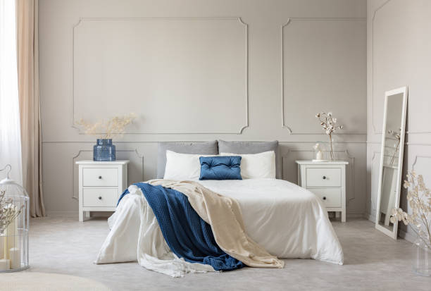 istock Stylish white, grey and petrol blue bedroom design, copy space on empty wall 1095372296