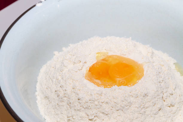 istock The egg is divided into white flour in the bowl 1095375910