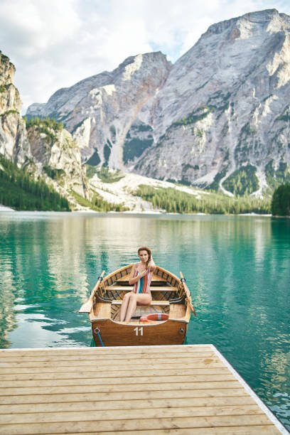istock Young lady enjoy the nature at a beautiful lake . 1095382006