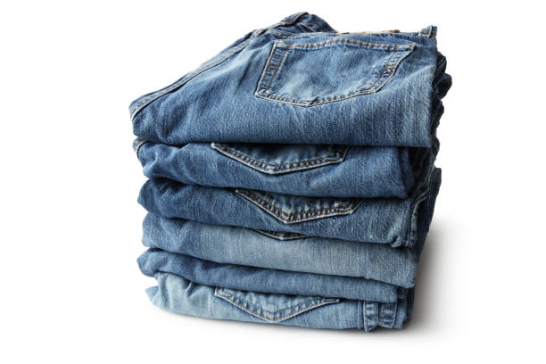 istock Clothes: Stacked Blue Jeans Isolated on White Background 1095382338