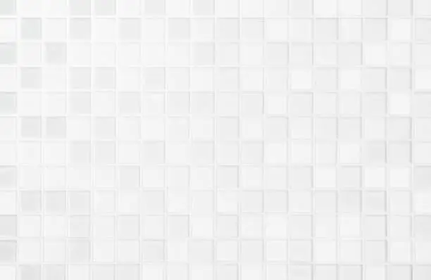 Photo of White or gray ceramic wall and floor tiles abstract background.