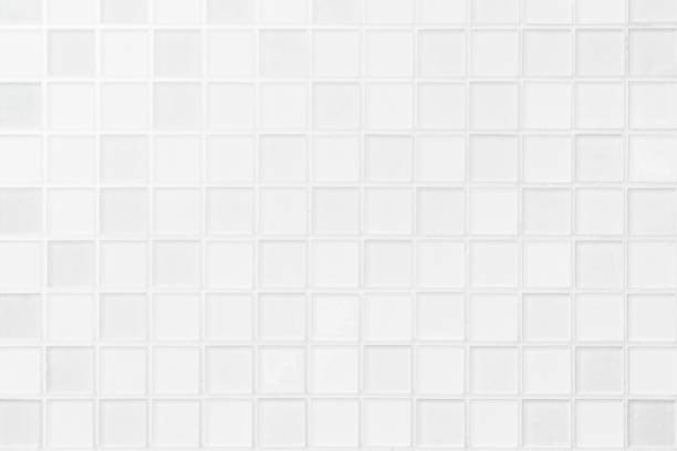 istock White or gray ceramic wall and floor tiles abstract background. 1095382882