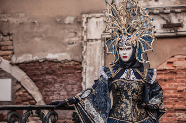 istock Attractive Female Posing in Venice Blue Colored Carnival Costume 1095386008