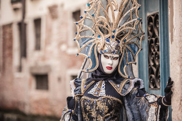 istock Attractive Female Posing in Venice Blue Colored Carnival Costume 1095386010