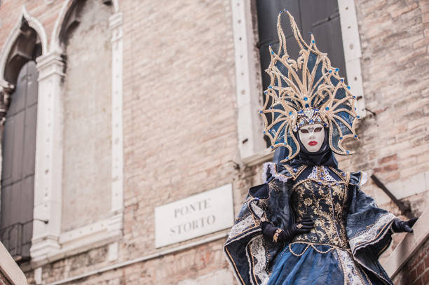 istock Attractive Female Posing in Venice Blue Colored Carnival Costume 1095386012