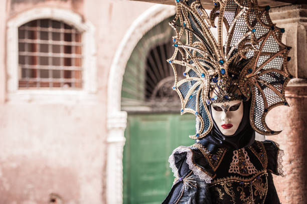 istock Attractive Female Posing in Venice Blue Colored Carnival Costume 1095386016