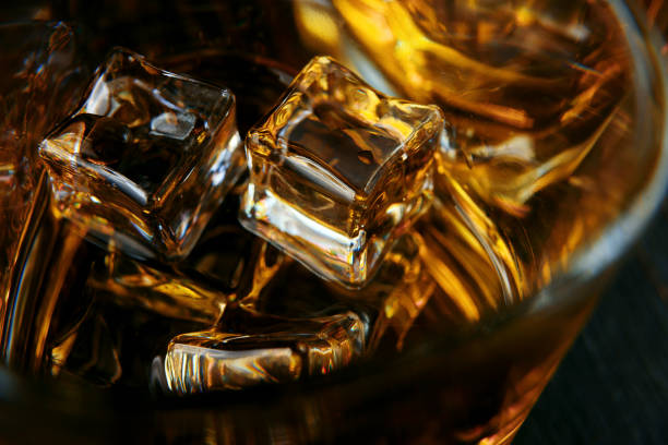 istock whiskey with ice in modern glasses 1095388628