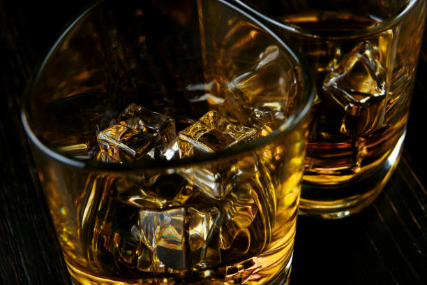 istock whiskey with ice in modern glasses 1095388672