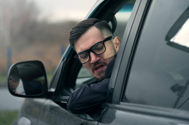 istock Successful businessman driving luxury car. 1095389134