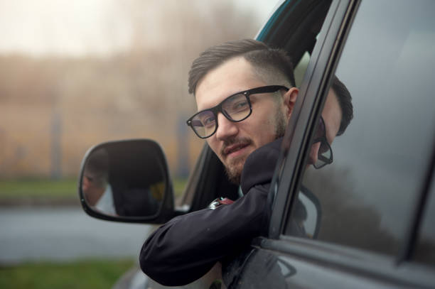 istock Successful businessman driving luxury car. 1095389486