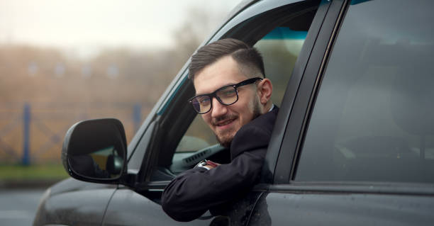istock Successful businessman driving luxury car. 1095389926