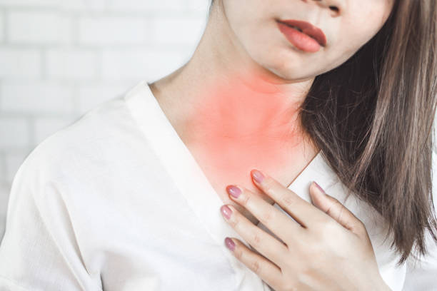 istock Asian woman suffering from acid reflux or heartburn 1095394704