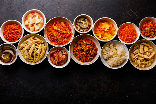 Korean food Pickled vegetables and Hot salads on dark background copy space