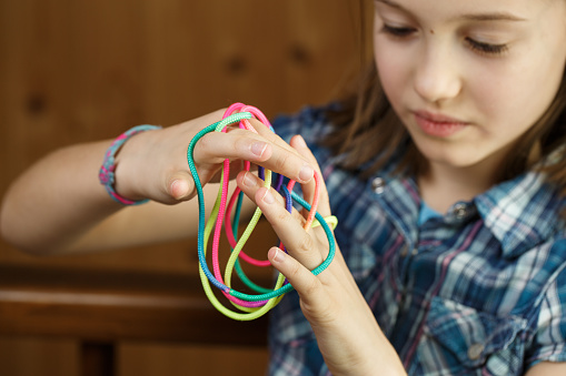 Green String Game Girl Playing Classic String Game Creating Shapes Stock Photo - Download ...