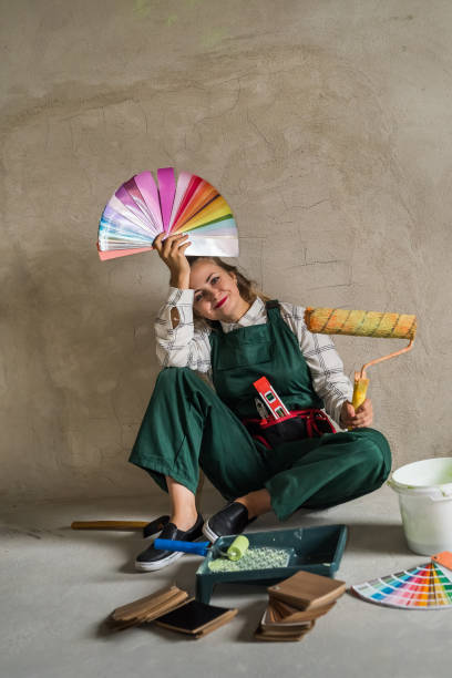 istock Woman posing with roller and colour swatch 1095401036