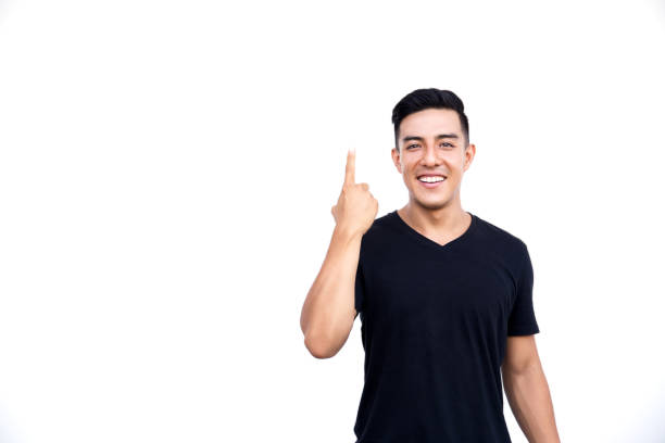 istock Handsome latin hispanic man is pointing up isolated on white background. 1095401232