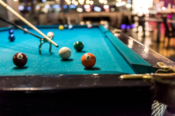 istock Billiard balls at table and rack for cue 1095405732