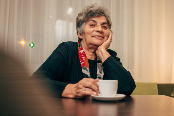 istock Happy senior lady enjoying in coffee 1095405826