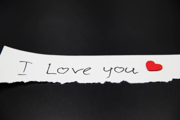 istock Paper message I love you on black smooth background. 1095406030
