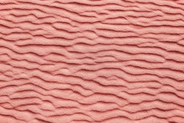 Photo of Coral color - living coral - color of year 2019 - Abstract organic texture, sand waves