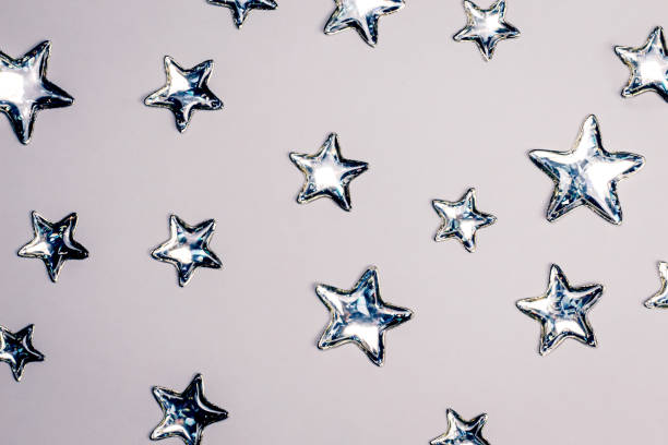 Shining Silver Stars On White Background Copy Space Stock Photo