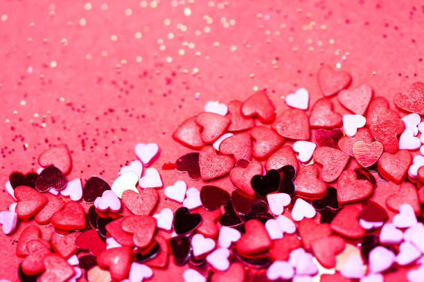 istock Valentine's day background. Little red hearts on pink background. 1095415584