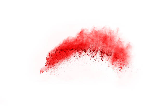 istock Freeze motion of red powder exploding, isolated on white background. Abstract design of red dust cloud. Particles explosion screen saver, wallpaper 1095420558