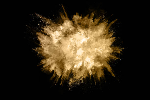 istock Golden powder explosion on black background. Freeze motion. 1095421704