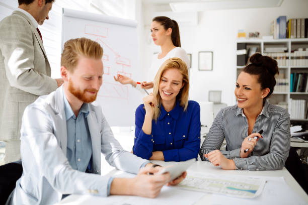 istock Group of business people working as team in office 1095422862