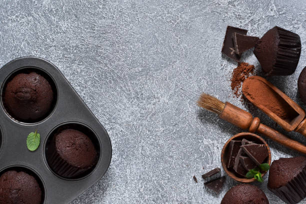 istock Chocolate muffins on a gray concrete background. Cupcakes. Cake. 1095424986