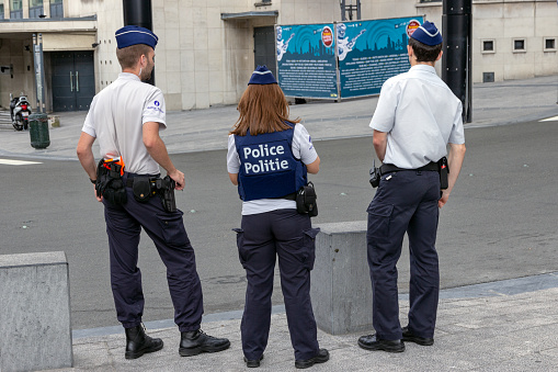 Brussels, Belgium - July 30, 2014: Three Belgian Flemish Police officers on watch near the Brussels Central Station.