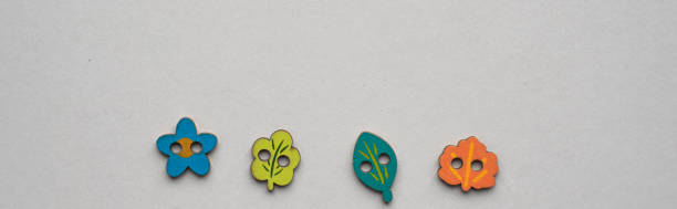 istock Wooden child style buttons multi colours at white background 1095426420