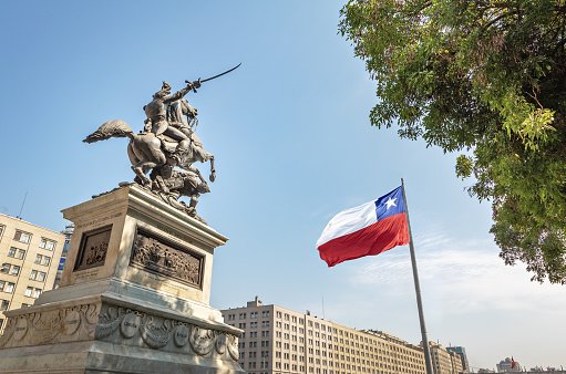 Estatua General de Bernardo O'Higgins en Plaza Bulnes y Chile Bicentenario bandera - Santiago, Chile photo