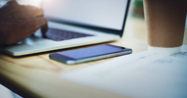 Shot of a businessman using his laptop at the office