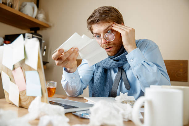 istock Sick man while working in office, businessman caught cold, seasonal flu. 1095446134