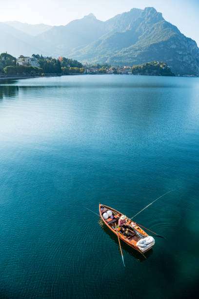 Lecco,Lombardy,Italy-09 october 2017: A lone fisherman on his boat on Lake Como near Lecco
