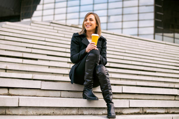istock Businesswoman drinking coffee 1095448518
