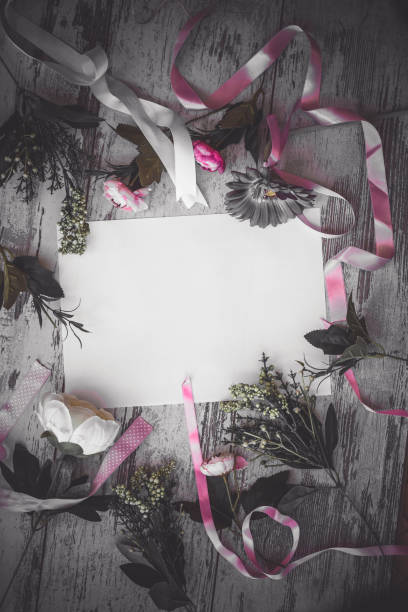 istock Flat lay with pink flowers dramatic toned picture 1095451036