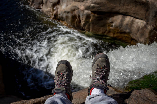 istock feet hanging in the river 1095453166