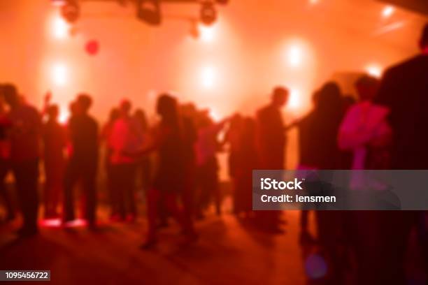 People Dancing At A Party Stock Photo - Download Image Now - Dance Floor, Illuminated, Lighting Equipment