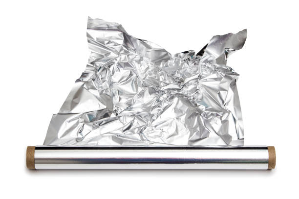 papel de aluminio para cocinar en un rollo - rolled up foil paper gray fotografías e imágenes de stock