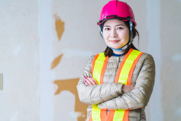 A portrait of a confident female construction worker.