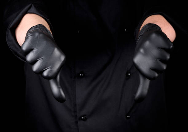 istock chef in black latex gloves shows gesture not like 1095469506