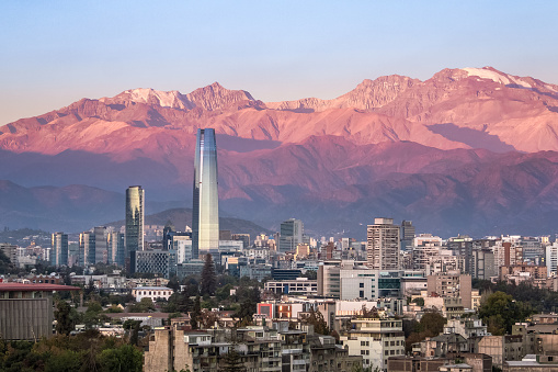 Aaerial vista del skyline de Santiago al atardecer con rascacielos Costanera y montañas de los Andes - Santiago, Chile photo