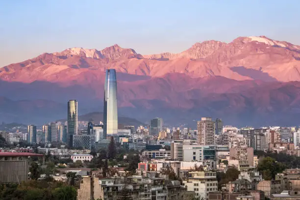 Photo of Aaerial view of Santiago skyline at sunset with Costanera skyscraper and Andes Mountains - Santiago, Chile