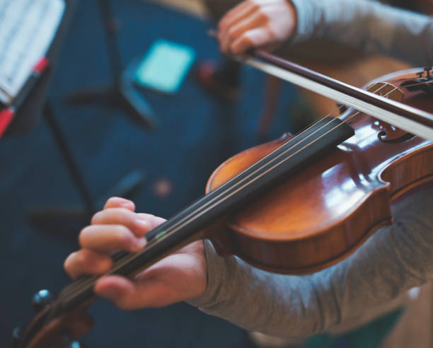 istock A little Anne-Sophie is practicing on her violin 1095475196