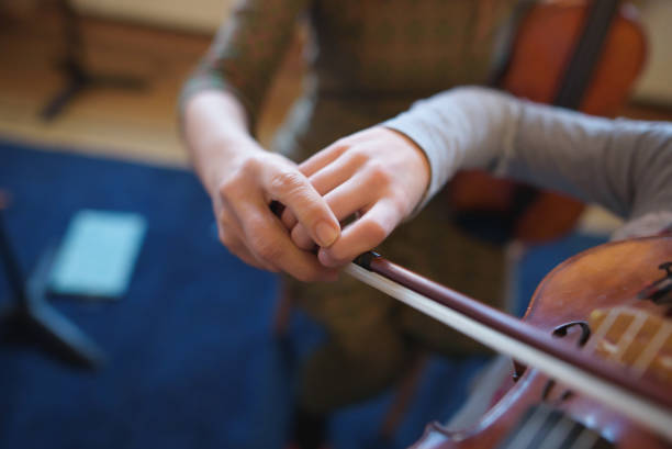 istock A little Anne-Sophie is practicing on her violin with her teacher 1095475408