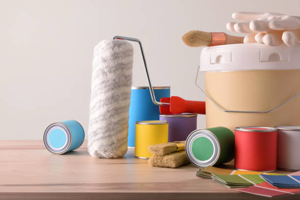 istock Table with painting tools for home white wall background detail 1095489558
