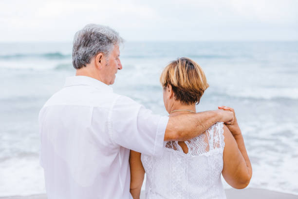 istock Happy senior couple on the beach 1095491446